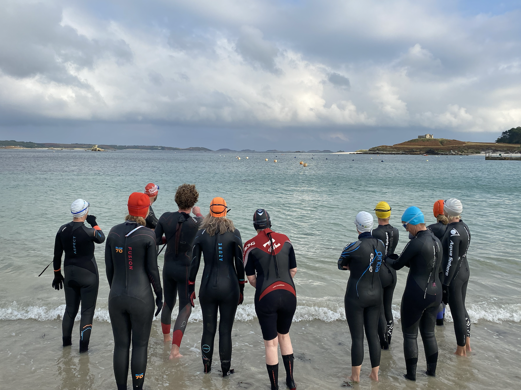 Group of swimmers about to enter the sea