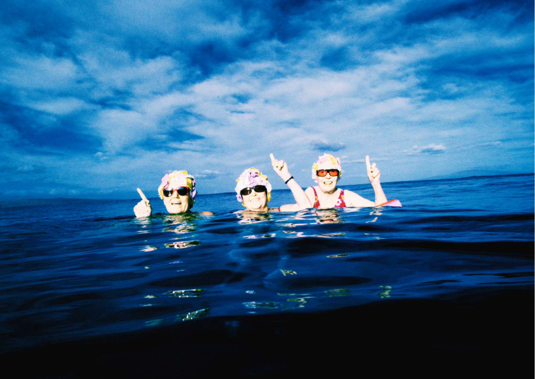 Three women swimming in the sea